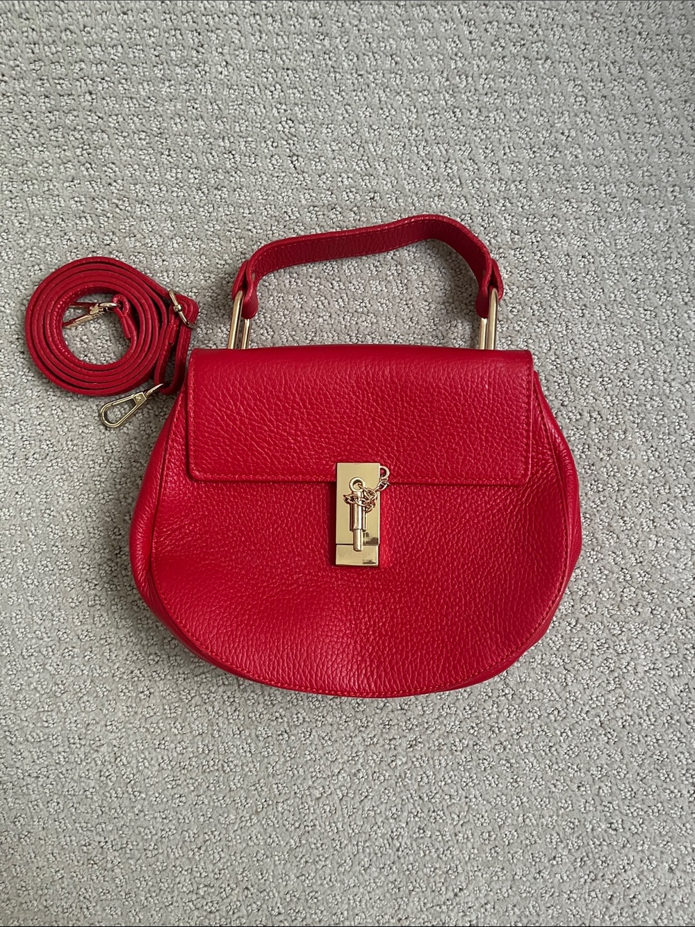 Structured Red Pebbled Crossbody Saddle Bag with Gold Hardware